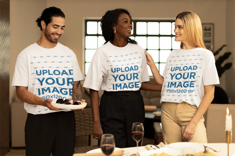 Stanely Stella T-Shirt Mockup Featuring Two Women and a Man Preparing the Table for Thanksgiving