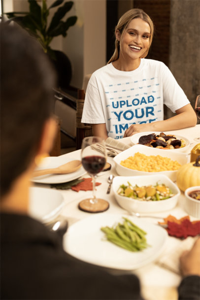 Stanley Stella Tee Mockup of a Woman Sitting at a Thanksgiving-Decorated Table