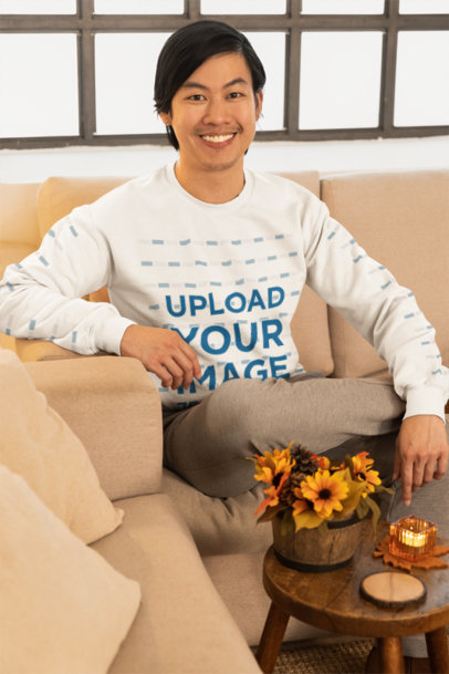 Thanksgiving-Themed Mockup of a Smiling Man Wearing a Round-Neck Sweatshirt