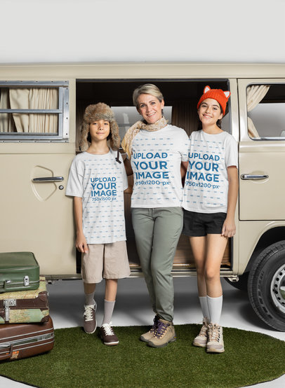Bella Canvas T-Shirt Mockup Featuring a Woman and Her Two Kids Posing by a Camper Van