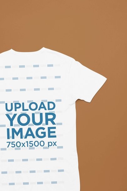 Back-View Mockup Featuring a Next Level T-Shirt Flat Laid over a Customizable Surface