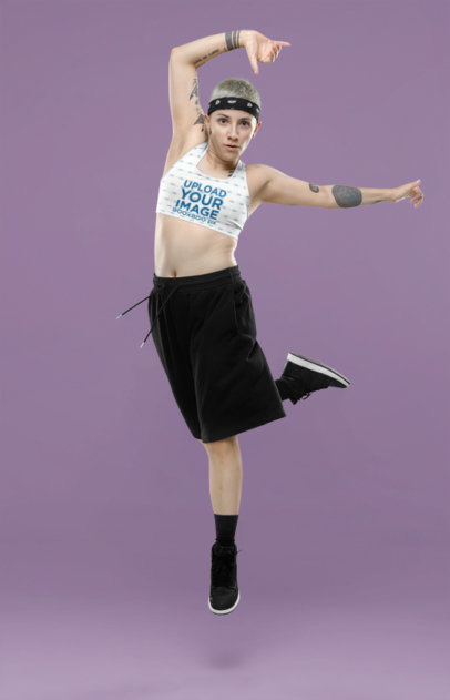 Sports Bra Mockup Featuring a Woman With Tattoos Breakdancing in a Studio