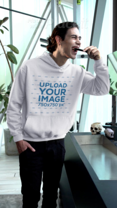 Halloween-Themed Hoodie Video Featuring a Vampire Brushing His Teeth
