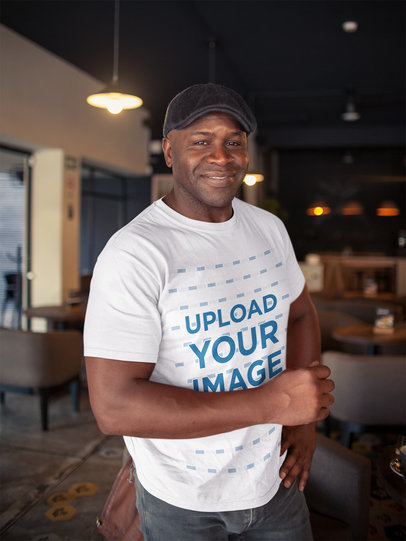 T-Shirt Mockup of a Happy Man Wearing a Beret