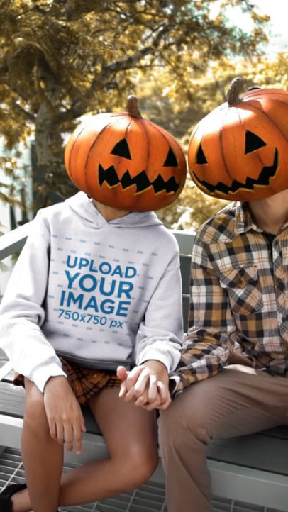 Halloween-Themed Hoodie Video of a Woman Wearing a Pumpkin Head
