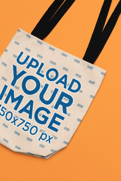 Mockup of a Sublimated Tote Bag Lying over a Removable Surface