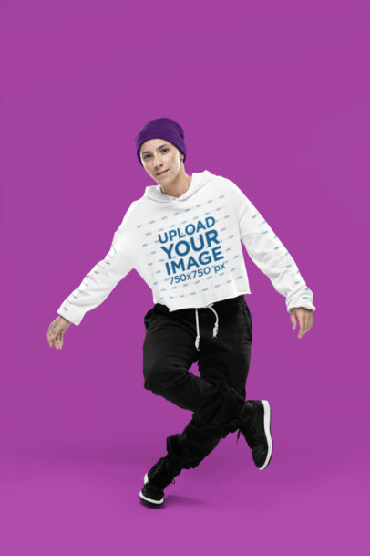 Crop Top Hoodie Mockup Featuring a Female Breakdancer Dancing in a Studio