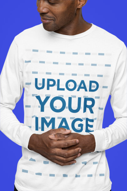 Mockup of a Man Wearing a Bella Canvas Long Sleeve T-Shirt in a Studio