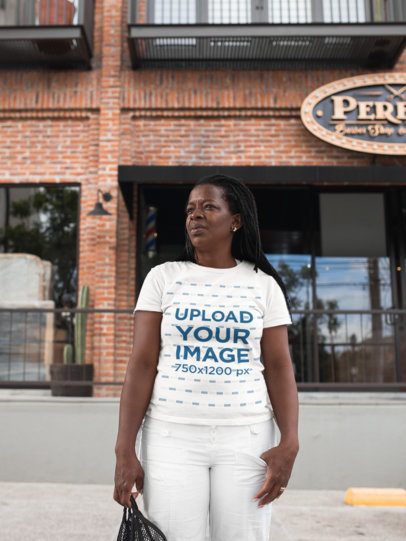 T-Shirt Mockup of a Woman Crossing the Street 21411