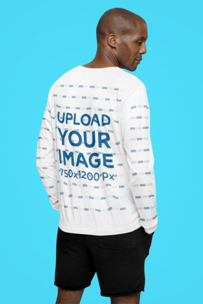 Back-View Bella Canvas Long-Sleeve Tee Mockup of a Calm Man Posing in a Studio