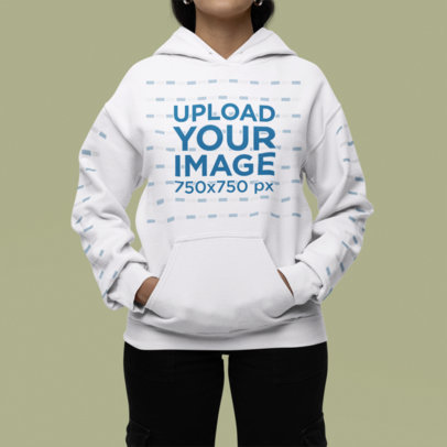 Mockup Featuring a Woman Wearing a Gildan Pullover Hoodie in a Studio