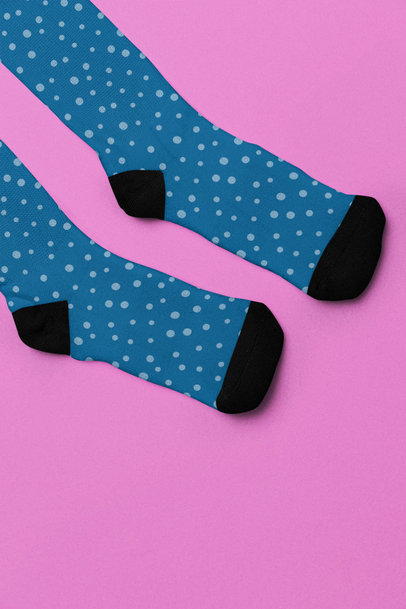 Mockup Featuring Two Sublimated Socks Placed over a Customizable Surface