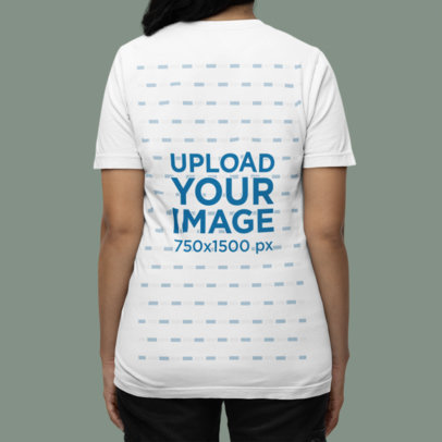 Back-View Mockup of a Woman Wearing a Bella Canvas T-Shirt in a Studio