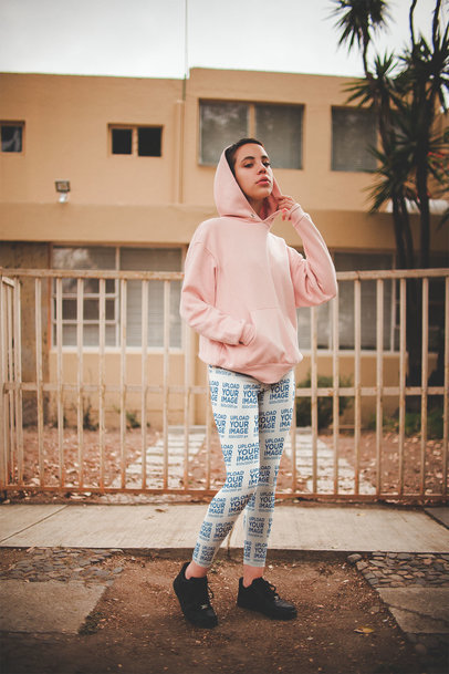 Leggings Mockup Featuring a Girl Wearing a Pink Hoodie Outside her House a19191