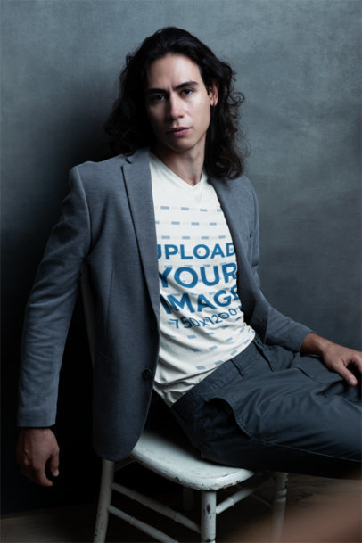 Bella Canvas V-Neck T-Shirt Mockup of a Serious Man Posing for an Editorial Photoshoot