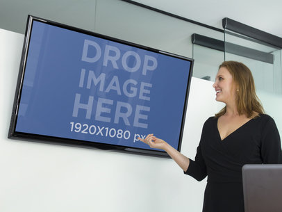 Business Woman at Executive Meeting With LG Flat Screen TV Mockup