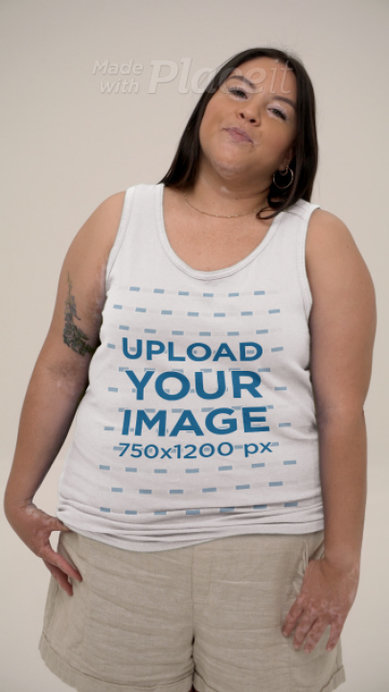 Video of a Tattooed Smiling Woman Wearing a Gildan Tank Top