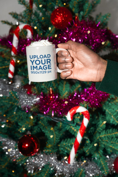 Xmas-Themed Mockup of a Man Holding a Coffee Mug With Hot Chocolate