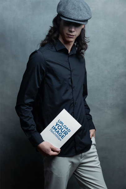 Book Mockup Featuring a Man Posing for an Editorial Photoshoot m33250