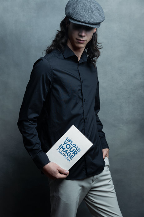 Book Mockup Featuring a Man Posing for an Editorial Photoshoot