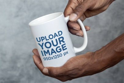 Mockup of a Man Holding a 15 oz Coffee Mug Close to the Camera m35752