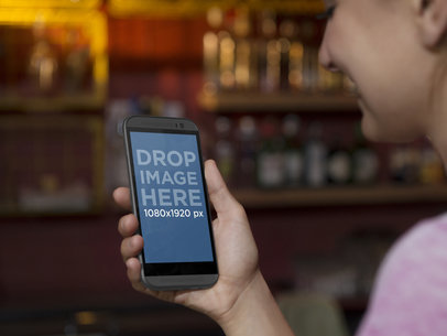 Android Mockup Generator of Woman Using HTC One At The Bar