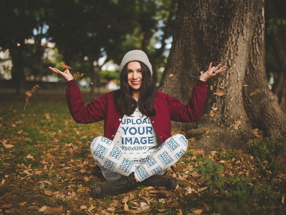 Women's Leggings Mockup of a Woman Playing with Leaves at a Park
