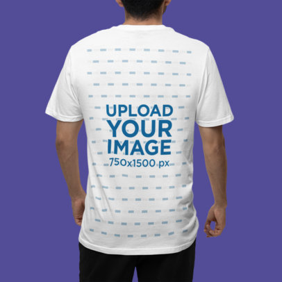 Back-View Mockup of a Man Standing in a Studio with a Gildan T-Shirt m35767