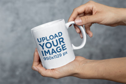 Mockup of a Woman Holding an 11 oz Coffee Mug Close to the Camera m35750