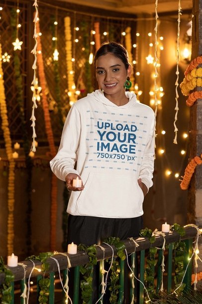 Gildan Hoodie Mockup of a Smiling Woman Holding a Candle for Diwali