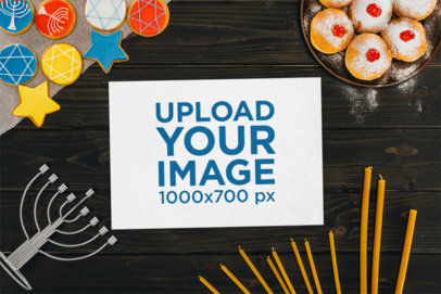 Mockup of a Flyer Lying on a Black Background Featuring a Hanukkah Theme