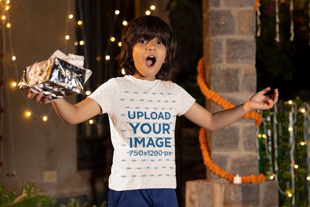 Heathered T-Shirt Mockup Featuring an Excited Boy With a Gift Celebrating Diwali