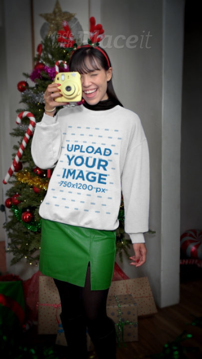 Gildan Sweatshirt Video Featuring a Happy Woman at a Christmas Party Taking a Picture