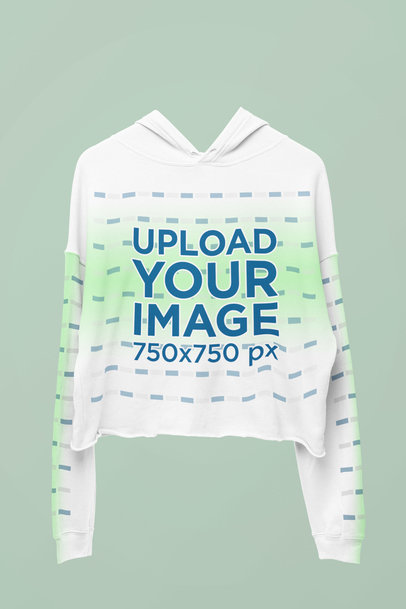 Degraded Mockup Featuring a Bella Canvas Crop Top Hoodie Placed on a Colorful Surface