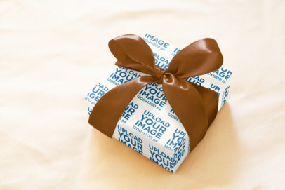 Wrapping Paper Mockup Featuring a Present in a Golden Background m35634 r-el2