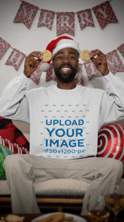 Gildan Sweatshirt Video Featuring a Happy Man With Christmas Cookies in His Eyes