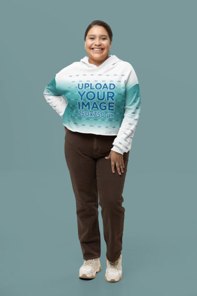 Bella Canvas Crop Top Hoodie Degraded Mockup of a Smiling Woman Standing in a Studio
