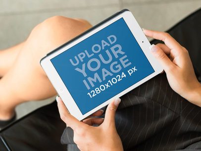 iPad Mockup Template of Businesswoman Using White iPad Mini