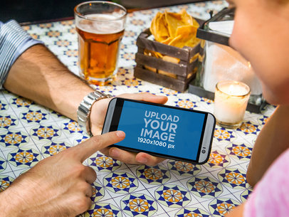 Couple Using HTC One M8 at Dinner Android Mockup