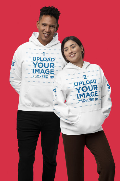 Gildan Pullover Hoodie Mockup of a Cute Couple Posing in a Studio