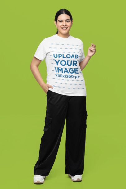 Gildan T-Shirt Mockup of a Cheerful Woman Posing in a Studio Against a Customizable Background