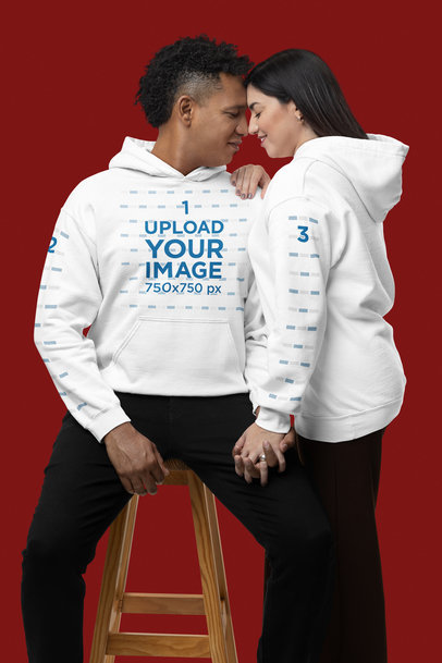 Gildan Pullover Hood Mockup Featuring a Sweet Couple Posing in a Studio