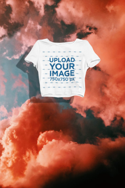 Mockup of a Bella Canvas Crop Top Floating Against a Customizable Background
