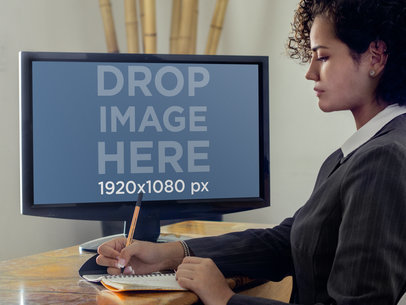 Mockup Template of Businesswoman Taking Notes and Using PC Desktop