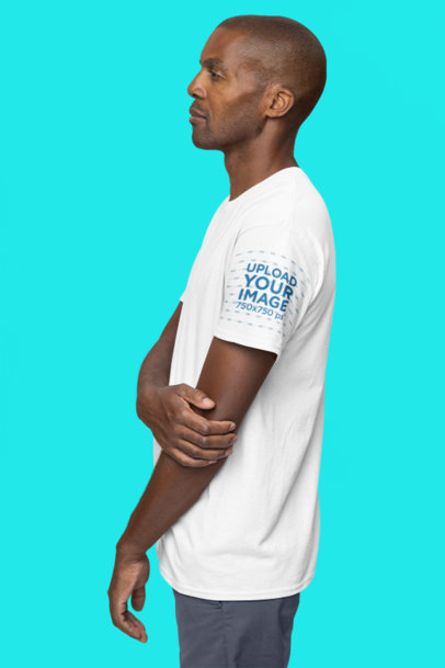 Gildan T-Shirt Mockup of a Serious Man Posing Against a Customizable Background