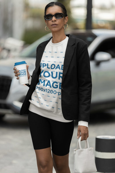 Coffee Cup Mockup of a Fashionable Woman Wearing a Gildan Sweatshirt 