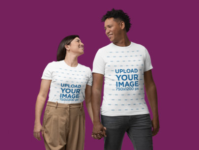 Bella Canvas T-Shirt Mockup Featuring a Smiling Couple Holding Hands in a Studio