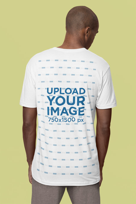 Back-View Next-Level T-Shirt Mockup of a Man Standing in a Studio