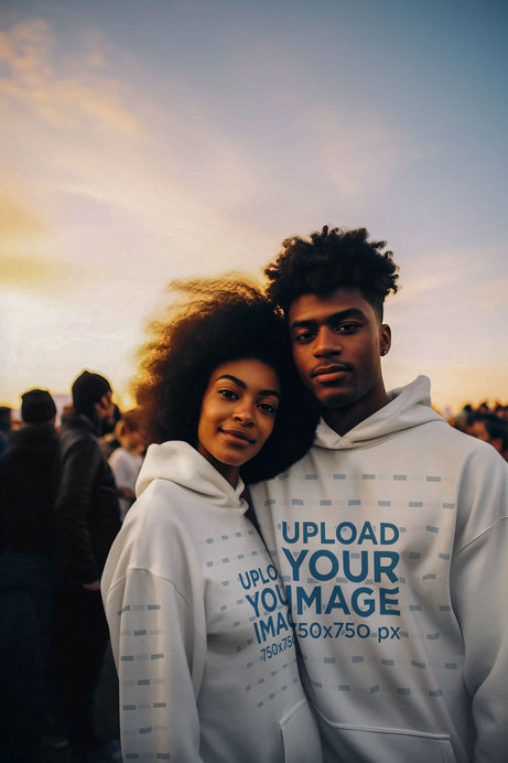 Pullover Hoodie Mockup of an AI-Generated Man and a Woman Posing in a Music Fest