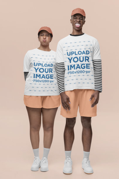 Stanley Stella T-Shirt Mockup Featuring a Man and Woman Posing With Funny Faces in a Studio m36575